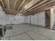 Unfinished basement featuring concrete floors, sealed walls, exposed beams, and roughed-in stairs to the upper level at 7730 Imperial Eagle Dr, Zionsville, IN 46077