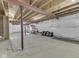 Unfinished basement featuring concrete floors, sealed walls, and exposed beams, ready for customization at 7730 Imperial Eagle Dr, Zionsville, IN 46077