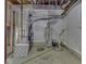 Unfinished basement with water heater, furnace, and bare concrete floor and covered foundation walls at 7730 Imperial Eagle Dr, Zionsville, IN 46077
