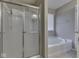 Bathroom with shower, soaking tub, and tile flooring at 7730 Imperial Eagle Dr, Zionsville, IN 46077