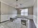 Bright dining area featuring wainscoting, two benches, hardwood floors, and modern lighting at 7730 Imperial Eagle Dr, Zionsville, IN 46077