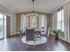 Bright dining room featuring modern lighting, a dining table, and a sliding door at 7730 Imperial Eagle Dr, Zionsville, IN 46077