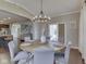 Bright dining room featuring modern lighting, a dining table, and hardwood floors at 7730 Imperial Eagle Dr, Zionsville, IN 46077