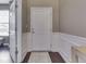 Inviting entryway with elegant molding, neutral walls, and a dark wood floor at 7730 Imperial Eagle Dr, Zionsville, IN 46077