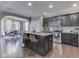 Updated kitchen with an island, stainless appliances, granite countertops, and bar seating, connected to dining area at 7730 Imperial Eagle Dr, Zionsville, IN 46077