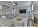Open living room featuring a fireplace, a TV, and a staircase at 7730 Imperial Eagle Dr, Zionsville, IN 46077