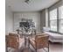 Modern home office with ample natural light, stylish furniture, and a comfortable chaise lounge at 7730 Imperial Eagle Dr, Zionsville, IN 46077