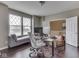 Cozy home office featuring a gray chaise lounge, a wide window, and a work desk at 7730 Imperial Eagle Dr, Zionsville, IN 46077