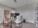 Home office features a gray chair, a desk with dual monitors, and a well-lit workspace at 7730 Imperial Eagle Dr, Zionsville, IN 46077