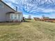 Large backyard with green grass, featuring a view of the home and surrounding landscape at 8358 Balmoral Dr, Avon, IN 46123