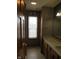 Bathroom featuring a vanity, mirror, tile floors, and window with natural light at 8358 Balmoral Dr, Avon, IN 46123