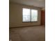 Bright bedroom with carpeted floors and windows offering a backyard view at 8358 Balmoral Dr, Avon, IN 46123