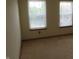 Bedroom with two windows with views of the outdoors and neutral carpeting at 8358 Balmoral Dr, Avon, IN 46123