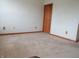 Empty bedroom showing neutral carpet, baseboard trim, and electrical outlets throughout at 8358 Balmoral Dr, Avon, IN 46123