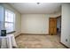 Empty bedroom with neutral carpet, a window, and a closet door, ready for personalization at 8358 Balmoral Dr, Avon, IN 46123