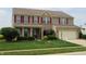 Traditional two-story home with red shutters, well-kept lawn, and attached garage at 8358 Balmoral Dr, Avon, IN 46123