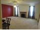 Spacious living room featuring a fireplace, carpeted floors, and bright windows at 8358 Balmoral Dr, Avon, IN 46123