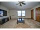 Living room featuring neutral carpet, a modern TV, and bright natural light at 8358 Balmoral Dr, Avon, IN 46123