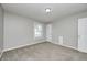 Neutral bedroom with carpet, a ceiling light, and a window at 901 W 250 N, Lebanon, IN 46052