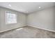 Clean, bright bedroom with neutral carpeting and a large window offering natural light at 901 W 250 N, Lebanon, IN 46052