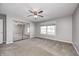 Spacious bedroom featuring a ceiling fan, mirrored closet, and large window at 901 W 250 N, Lebanon, IN 46052