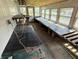 Interior of a shed displaying shelving with window lighting and concrete flooring at 901 W 250 N, Lebanon, IN 46052