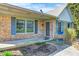 Charming brick home featuring a covered front porch and well-manicured landscaping at 901 W 250 N, Lebanon, IN 46052