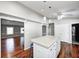 Open kitchen with a granite island, pendant lighting, and hardwood floors at 901 W 250 N, Lebanon, IN 46052