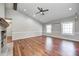 Large living room with vaulted ceiling, wood beam, fireplace, and natural light at 901 W 250 N, Lebanon, IN 46052