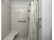 Accessible shower includes a built-in seat, grab bar, and modern tile at 901 W 250 N, Lebanon, IN 46052