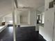 Large attic space with high ceilings, windows, and white walls at 902 N Broadway St, Indianapolis, IN 46202