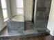 Modern bathroom featuring a soaking tub and slate tiled shower at 902 N Broadway St, Indianapolis, IN 46202