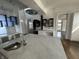 Bright, open kitchen with marble counters and stainless steel appliances at 902 N Broadway St, Indianapolis, IN 46202