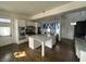 Modern kitchen featuring stainless steel appliances, a center island with marble countertop, and hardwood floors at 902 N Broadway St, Indianapolis, IN 46202