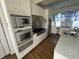Modern kitchen featuring stainless steel appliances and stylish white cabinets at 902 N Broadway St, Indianapolis, IN 46202