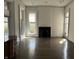 Bright living room with hardwood floors, fireplace, and plenty of natural light at 902 N Broadway St, Indianapolis, IN 46202
