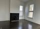 Living room with fireplace and large windows, offering plenty of natural light at 902 N Broadway St, Indianapolis, IN 46202