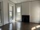 Bright living room with hardwood floors, fireplace, and plenty of natural light at 902 N Broadway St, Indianapolis, IN 46202