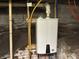 Tankless water heater with visible pipes and connections in basement at 902 N Broadway St, Indianapolis, IN 46202