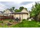 Inviting backyard featuring a patio, fire pit, and lush greenery for outdoor enjoyment at 902 Villa Ave, Indianapolis, IN 46203