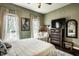 Comfortable bedroom with view of window with chair near dresser at 902 Villa Ave, Indianapolis, IN 46203