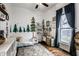 Playful room with tree art and hardwood floors at 902 Villa Ave, Indianapolis, IN 46203