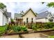 Quaint single-story home showcasing a delightful fenced front yard and established landscaping at 902 Villa Ave, Indianapolis, IN 46203
