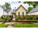 Charming single-story home featuring a lovely fenced front yard and well-maintained landscaping at 902 Villa Ave, Indianapolis, IN 46203