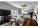A cozy living room open to the kitchen and dining area, with neutral decor at 902 Villa Ave, Indianapolis, IN 46203