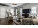 Living room with hardwood floors, neutral decor, and modern entertainment center at 902 Villa Ave, Indianapolis, IN 46203