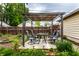 Cozy backyard patio with a shaded pergola and outdoor seating, perfect for relaxation at 902 Villa Ave, Indianapolis, IN 46203