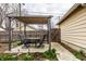 Cozy backyard patio with a pergola-covered dining area, perfect for outdoor relaxation and entertaining guests at 902 Villa Ave, Indianapolis, IN 46203