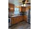 Bright kitchen featuring updated appliances and stylish wooden cabinets at 9235 Thrushwood Ln, Indianapolis, IN 46250