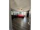 A primary bedroom features hardwood flooring, a ceiling fan, and nice natural lighting at 9235 Thrushwood Ln, Indianapolis, IN 46250